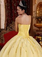 Light Yellow Sweetheart Crystals Decorate Quinceanera Dress